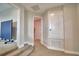 Hallway featuring carpet floors and access to several rooms at 445 Waterfern Trail Dr, Auburndale, FL 33823