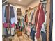 Spacious walk-in closet with ample storage and built-in organization at 445 Waterfern Trail Dr, Auburndale, FL 33823