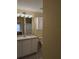 Cozy bathroom featuring a single sink vanity, white cabinets, and tile flooring at 4488 Turnberry Ln, Lake Wales, FL 33859
