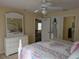 Spacious bedroom featuring a bright dresser, comfortable bedding, and multiple closets for ample storage space at 4488 Turnberry Ln, Lake Wales, FL 33859