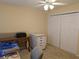 Bright bedroom with double closet, ceiling fan, and neutral carpet at 4488 Turnberry Ln, Lake Wales, FL 33859