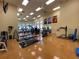 Well-equipped gym featuring state-of-the-art fitness machines and workout equipment on hardwood floors at 4488 Turnberry Ln, Lake Wales, FL 33859