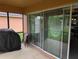 Patio with outdoor seating and sliding glass doors at 4488 Turnberry Ln, Lake Wales, FL 33859