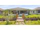 Backyard featuring a lovely wood bridge leading to a screened in porch at 469 Sweetwater Way, Haines City, FL 33844