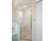 Bathroom featuring a glass-enclosed shower with tiled walls and a built-in seat at 469 Sweetwater Way, Haines City, FL 33844
