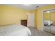 Bedroom featuring plush carpet, natural light, and a mirrored closet at 469 Sweetwater Way, Haines City, FL 33844
