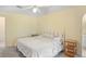 Cozy bedroom with a ceiling fan, neutral colors, and carpet flooring at 469 Sweetwater Way, Haines City, FL 33844