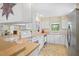 Functional kitchen with white cabinets and updated appliances at 469 Sweetwater Way, Haines City, FL 33844