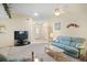 Spacious living room featuring carpet flooring and a ceiling fan at 469 Sweetwater Way, Haines City, FL 33844