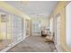 Home office with built-in shelving, natural light, and neutral color palette at 469 Sweetwater Way, Haines City, FL 33844