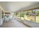 Covered porch with lots of seating and views of the beautiful yard at 469 Sweetwater Way, Haines City, FL 33844