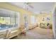 Sunroom featuring tile floor, natural light, and access to the hot tub at 469 Sweetwater Way, Haines City, FL 33844
