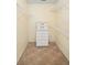 Walk-in closet with shelving, drawers, and neutral walls at 469 Sweetwater Way, Haines City, FL 33844