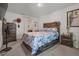 Comfortable bedroom with a wooden bed frame and soft patterned bedding at 47 Willow Ln, Kissimmee, FL 34759