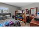 Bedroom featuring a bunk bed, single bed, dresser and window that allows in natural light at 47 Willow Ln, Kissimmee, FL 34759