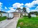 Charming single-story home with a well-maintained lawn, driveway, and appealing curb appeal at 47 Willow Ln, Kissimmee, FL 34759