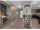 Inviting hallway with laminate flooring, decorative accents, and views into the kitchen and living areas at 47 Willow Ln, Kissimmee, FL 34759