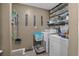 Functional laundry area with washer, dryer, and decorative 'Wash, Dry, Fold' signs at 47 Willow Ln, Kissimmee, FL 34759