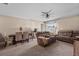 Comfortable living room with plush seating, a dining area, and abundant natural light at 47 Willow Ln, Kissimmee, FL 34759