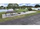 A view of a picnic shelter with tables and seating by a community parking lot at 4859 Foxwood Blvd, Lakeland, FL 33810