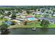 Scenic aerial view featuring a lake, recreational amenities, and lush green spaces in the community at 4859 Foxwood Blvd, Lakeland, FL 33810