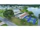 Aerial showcasing pickleball and shuffleboard courts, next to community pool at 4859 Foxwood Blvd, Lakeland, FL 33810