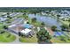 Overhead shot of community amenities including lake, clubhouse, pool, and tennis courts at 4859 Foxwood Blvd, Lakeland, FL 33810