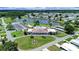Expansive aerial view of community with a lake, clubhouse, and beautifully landscaped grounds at 4859 Foxwood Blvd, Lakeland, FL 33810