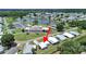 Aerial view of a blue home near a lake, pool, and community center at 4859 Foxwood Blvd, Lakeland, FL 33810