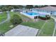 Aerial view of the community pool area with a basketball court and shuffleboard, providing fun and recreation at 4859 Foxwood Blvd, Lakeland, FL 33810