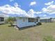 A cozy home with a screened in porch and green grass yard at 4859 Foxwood Blvd, Lakeland, FL 33810