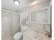 Neat bathroom features a sliding glass door shower and sleek vanity at 4859 Foxwood Blvd, Lakeland, FL 33810