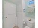Bright bathroom featuring built-in storage and toilet in a clean and functional space at 4859 Foxwood Blvd, Lakeland, FL 33810