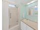 Bright bathroom featuring a shower-tub combination and single sink vanity with cabinet storage at 4859 Foxwood Blvd, Lakeland, FL 33810