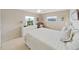 Comfortable bedroom featuring a ceiling fan, dresser, and natural light from multiple windows at 4859 Foxwood Blvd, Lakeland, FL 33810
