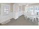 Charming dining area with natural light, white table, chairs and built in china cabinet at 4859 Foxwood Blvd, Lakeland, FL 33810