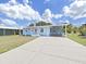 Charming single-story home with a carport and well-maintained front yard at 4859 Foxwood Blvd, Lakeland, FL 33810