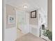 Hallway leading to bathroom features neutral tones and decor at 4859 Foxwood Blvd, Lakeland, FL 33810