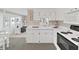 Bright kitchen featuring white cabinets, sleek countertops, and modern appliances at 4859 Foxwood Blvd, Lakeland, FL 33810