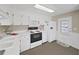 Efficient kitchen featuring white cabinets, modern appliances, and lots of counter space at 4859 Foxwood Blvd, Lakeland, FL 33810