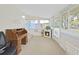 Sunroom with fireplace, large windows, desk, and chair providing an inviting atmosphere at 4859 Foxwood Blvd, Lakeland, FL 33810