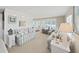 Bright living room featuring stylish, striped sofas, neutral walls, and large windows at 4859 Foxwood Blvd, Lakeland, FL 33810