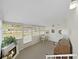 Bright sunroom with fireplace, large windows, and a table with chairs; ideal for relaxing at 4859 Foxwood Blvd, Lakeland, FL 33810