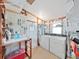 A functional workshop with storage, a laundry setup, and pegboard walls at 4859 Foxwood Blvd, Lakeland, FL 33810