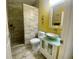 Bathroom featuring a standing shower, toilet, and vanity with sink at 5005 Pebble Beach Blvd, Winter Haven, FL 33884