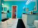 A vivid bathroom with a vessel sink and an adjacent walk-in shower at 5005 Pebble Beach Blvd, Winter Haven, FL 33884