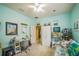 Cozy bedroom with a desk, daybed, and neutral walls at 5005 Pebble Beach Blvd, Winter Haven, FL 33884