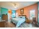 Cozy bedroom with ceiling fan, wood floors and a bright and airy feel at 5005 Pebble Beach Blvd, Winter Haven, FL 33884