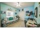 Bedroom with a comfortable couch, desk, and neutral walls at 5005 Pebble Beach Blvd, Winter Haven, FL 33884