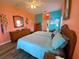 Bedroom featuring wood floors and plenty of dresser storage at 5005 Pebble Beach Blvd, Winter Haven, FL 33884